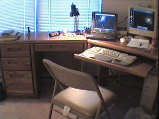 Desk with laptop and tower.
