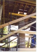 The 15 foot tall concrete block column looking from below up and through the pier opening of the deck which is twelve feet above the column base.