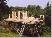 The ten foot by ten foot by 6 foot high building is framed.