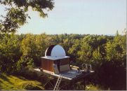 This is a view looking northwest from my upstaris north balcony. It shows Petit Jean mountain in the distance on the right. The dome is installed, the east wall siding is up and sealed in this view. 