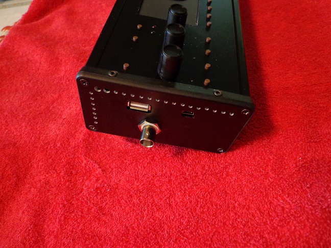 Case, left end view shows antenna and usb connections.