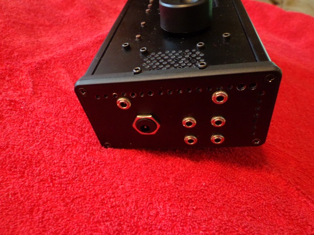 Case, right view shows 6 audio and one DC connections.