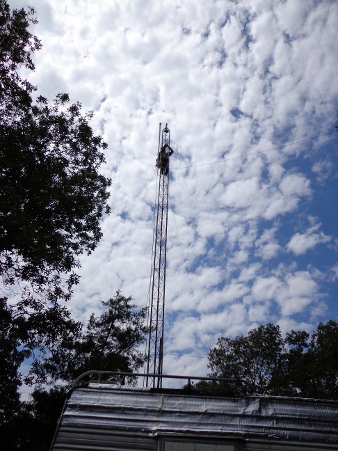 Don on tower at 50ft section tying off the gin pole rope for top section removal.